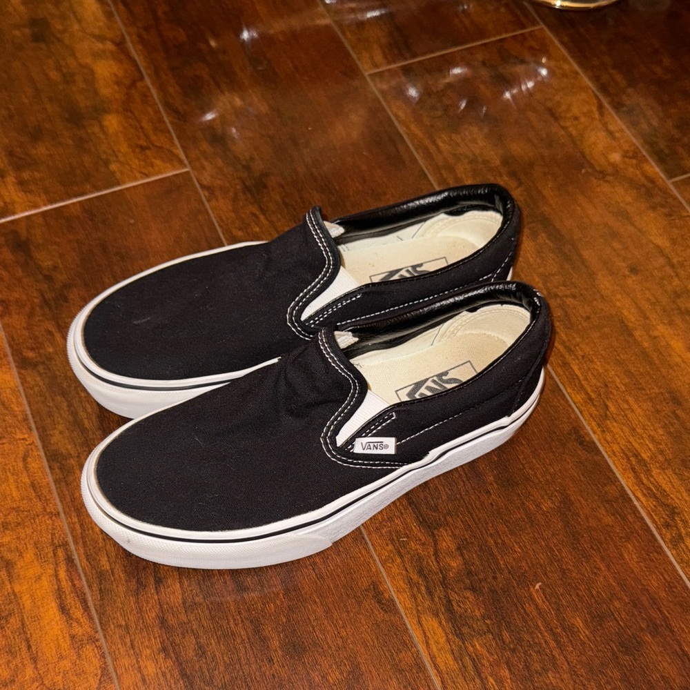 Vans Black and White Slip-On Sneakers